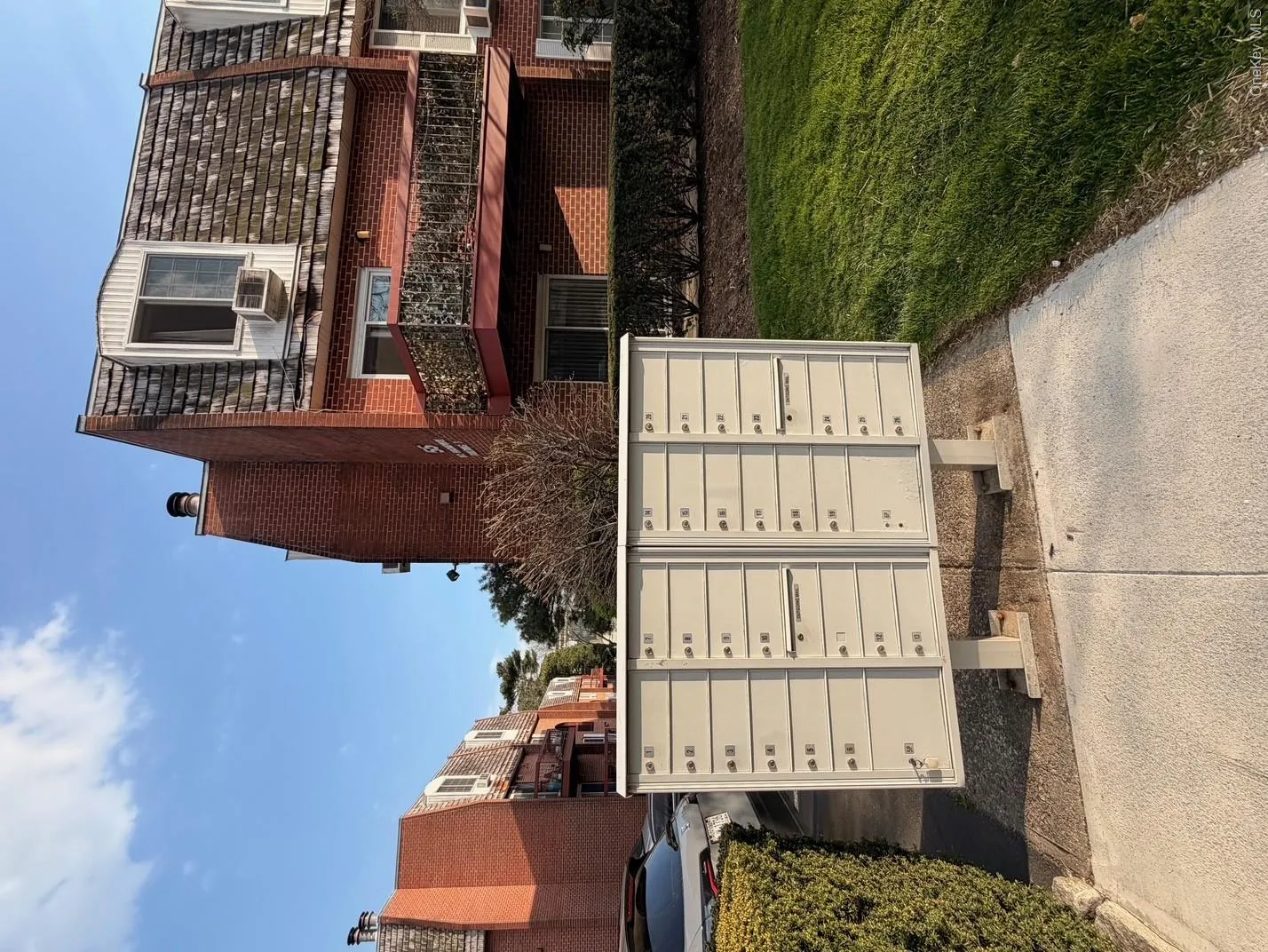 The property features a brick exterior with a distinctive mansard roof design The property features a brick exterior with a distinctive mansard roof design