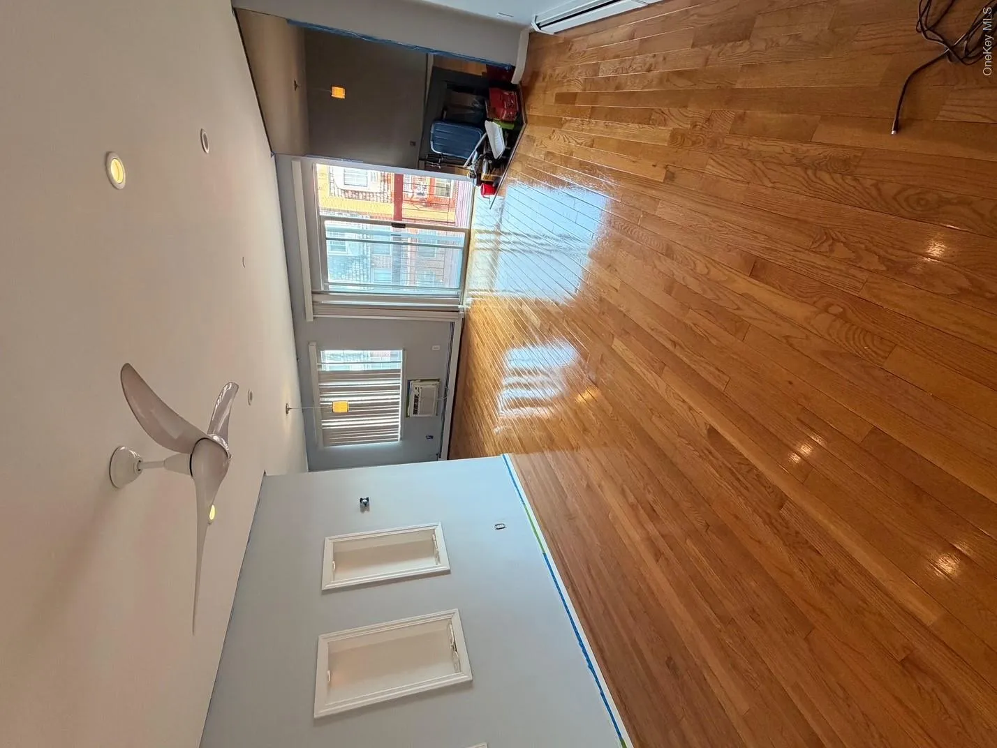 This expansive space features polished hardwood floors, recessed lighting, and a modern ceiling fan This expansive space features polished hardwood floors, recessed lighting, and a modern ceiling fan