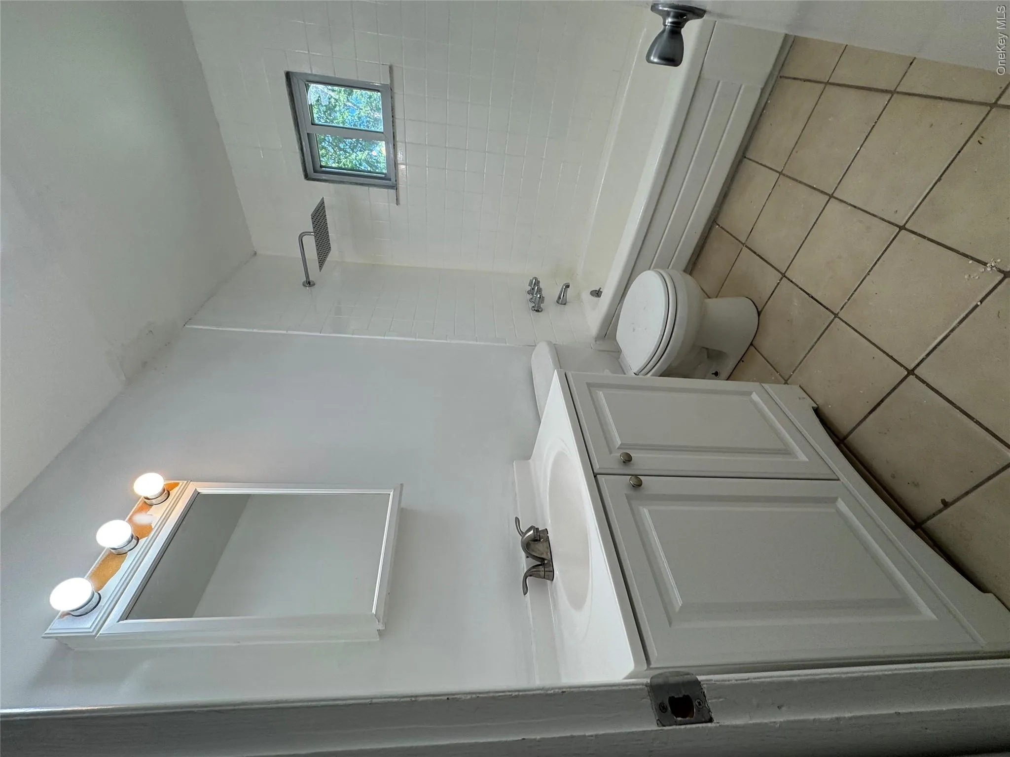 The bathroom is bright and updated. It has a rain head shower that offers relaxation and great water pressure. The bathroom is bright and updated. It has a rain head shower that offers relaxation and great water pressure.
