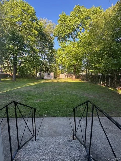 The backyard is so beautiful and private. The lawn is inviting and flat. The backyard is so beautiful and private. The lawn is inviting and flat.