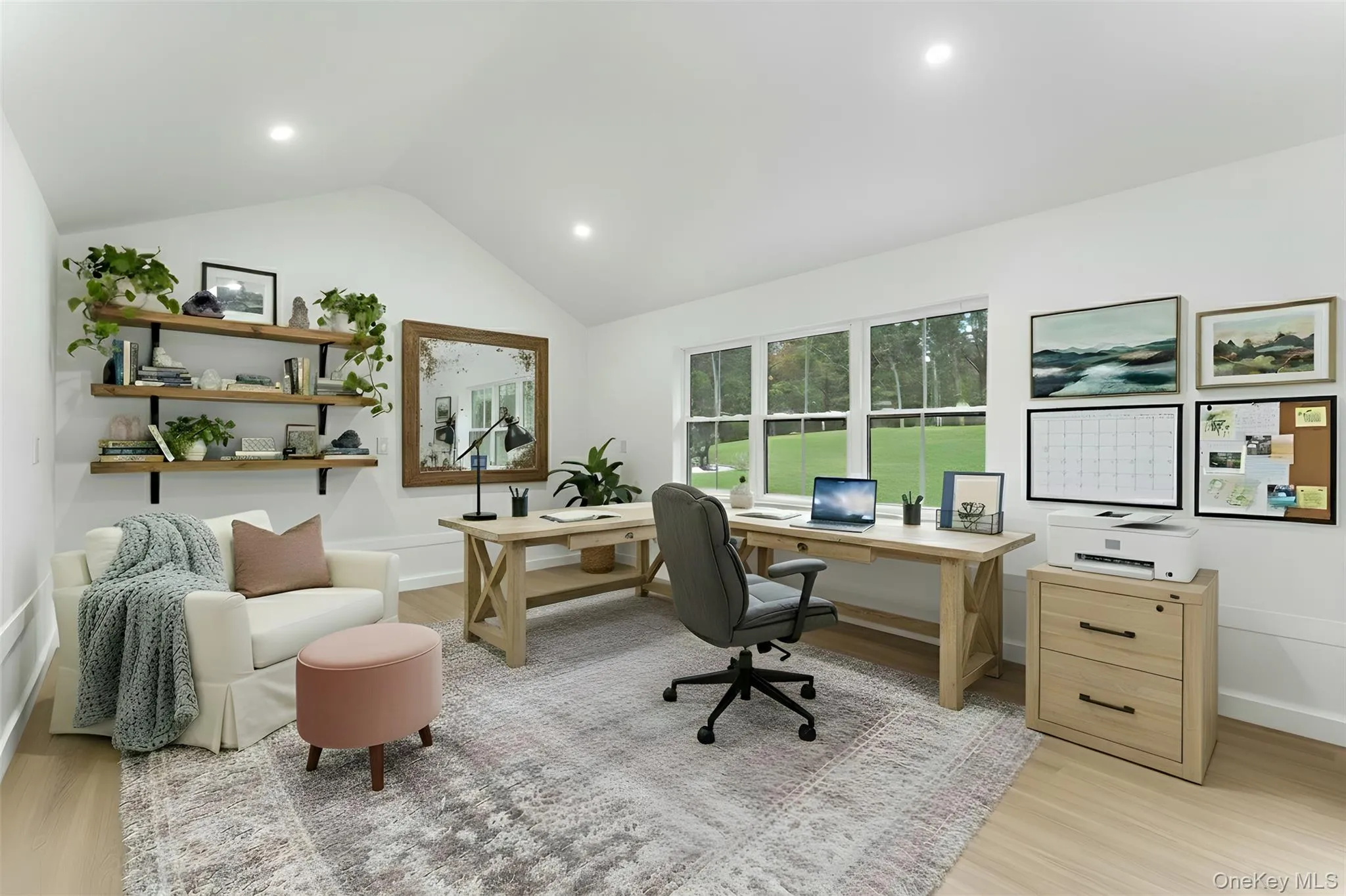 Office/Studio/Workshop area in shed to the left of the property with light wood finished floors, vaulted ceiling, and recessed lighting Office/Studio/Workshop area in shed to the left of the property with light wood finished floors, vaulted ceiling, and recessed lighting