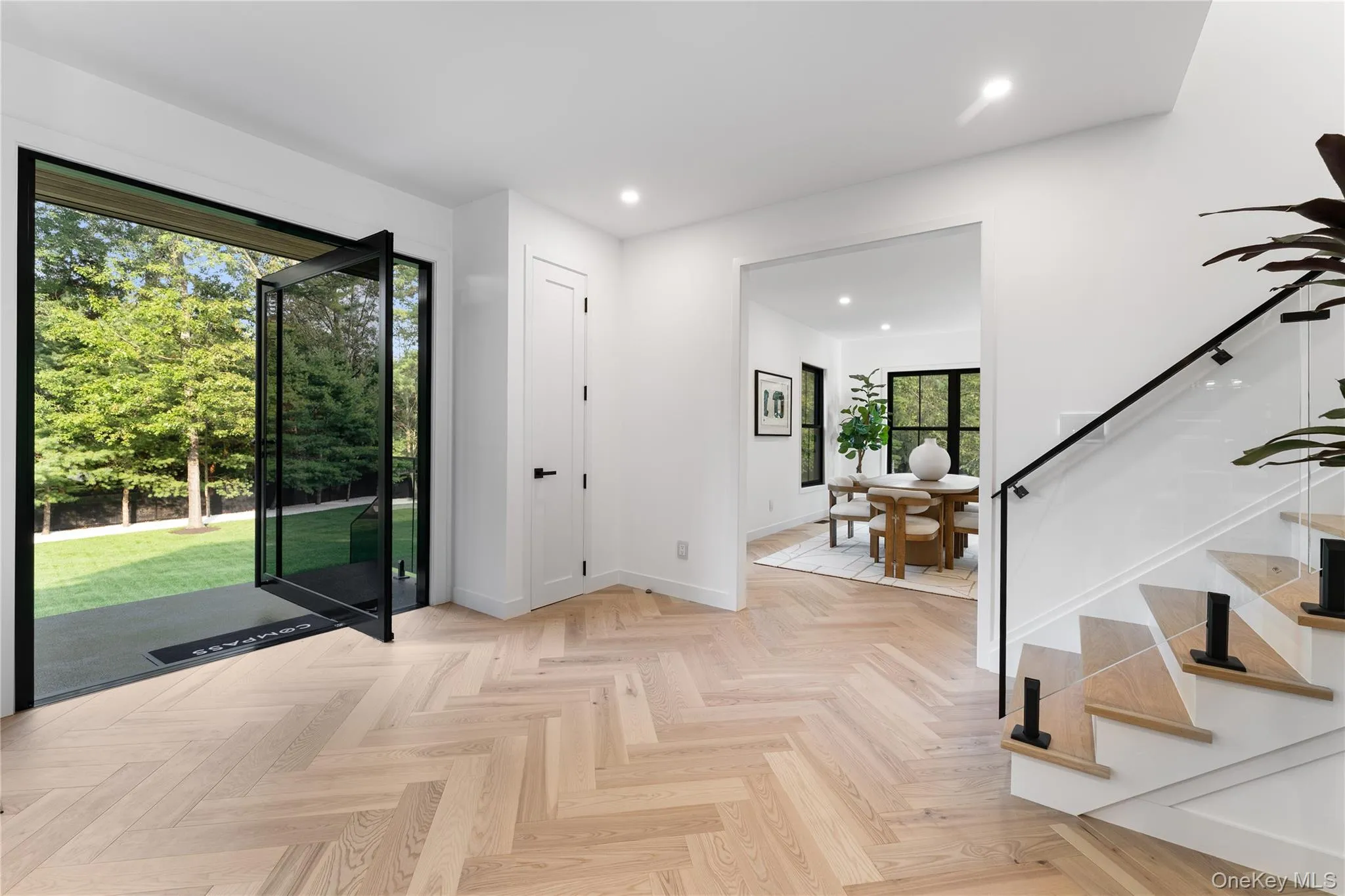 Entryway with recessed lighting and stairs Entryway with recessed lighting and stairs