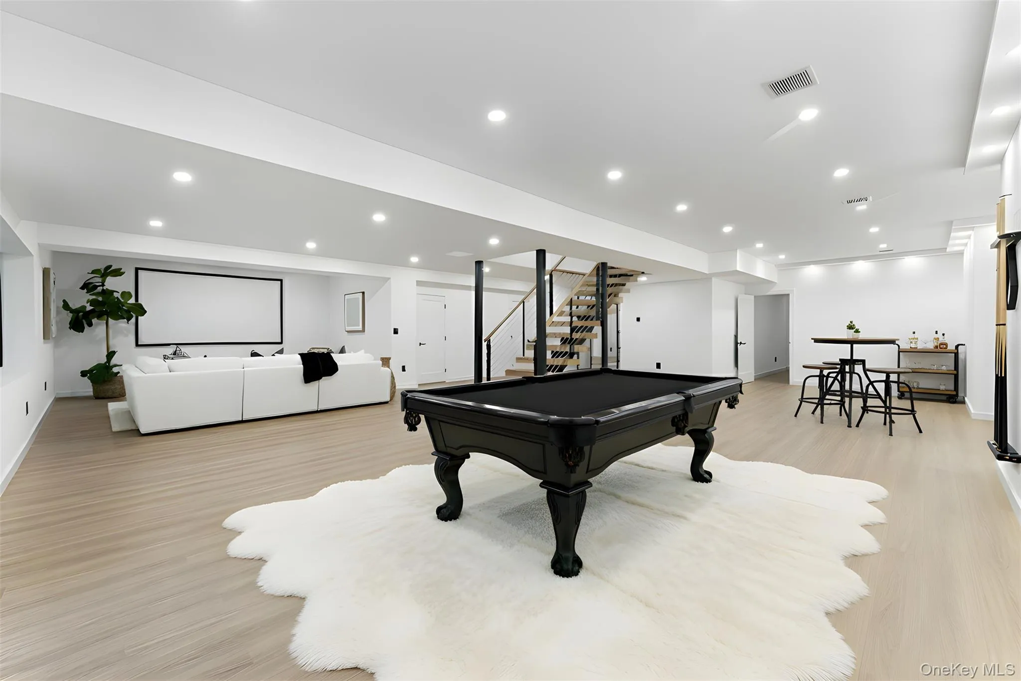 Recreation/Finished Basement featuring pool table, light wood-style floors, and recessed lighting Recreation/Finished Basement featuring pool table, light wood-style floors, and recessed lighting