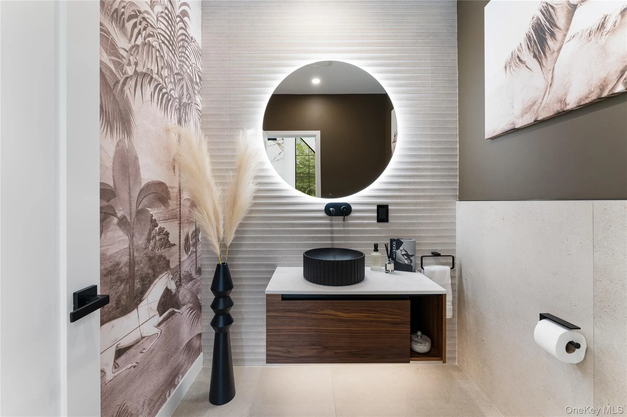 Main Level Half Bath featuring vanity, tile patterned flooring, and tile walls Main Level Half Bath featuring vanity, tile patterned flooring, and tile walls