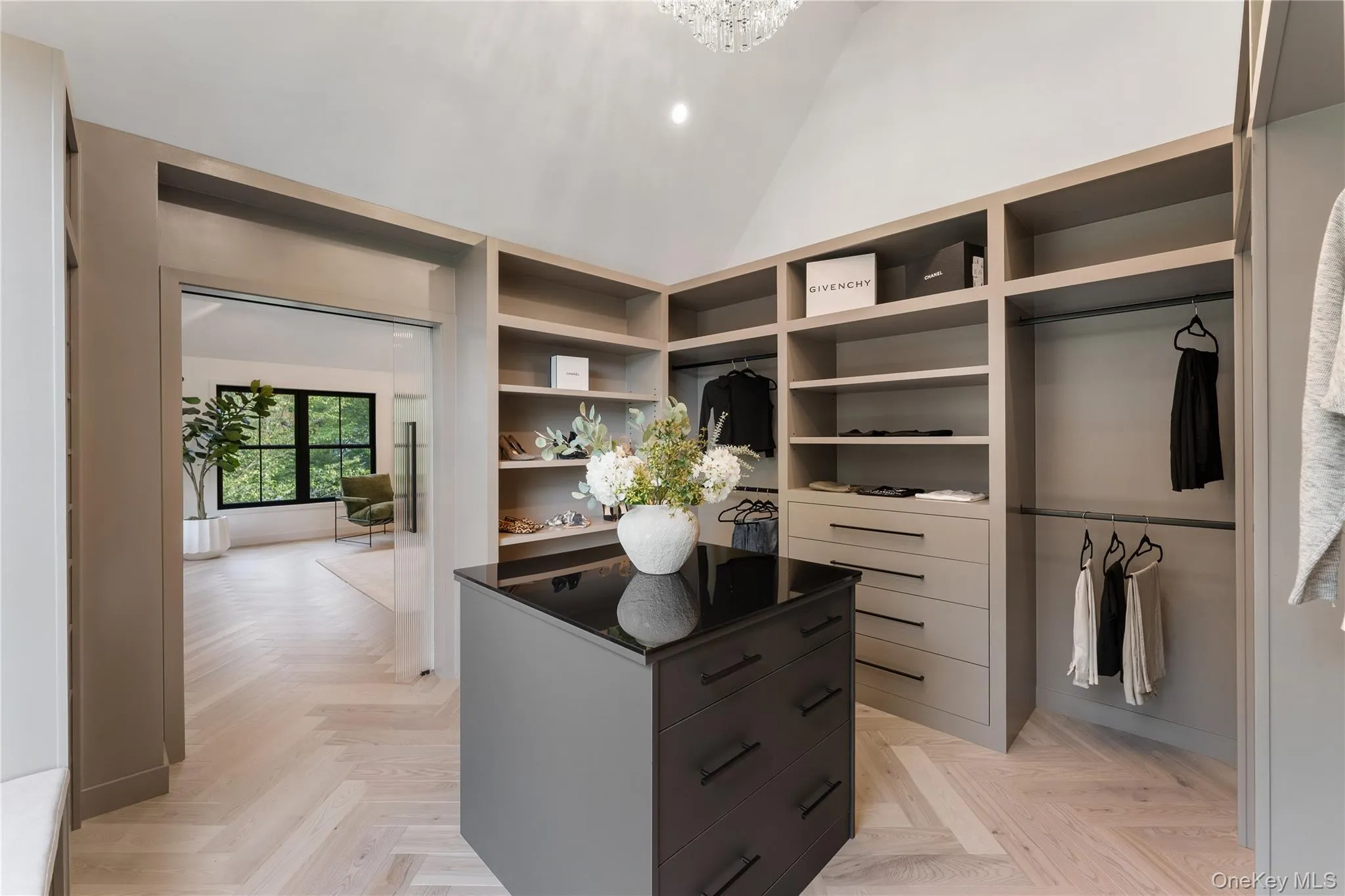 Spacious closet featuring high vaulted ceiling Spacious closet featuring high vaulted ceiling