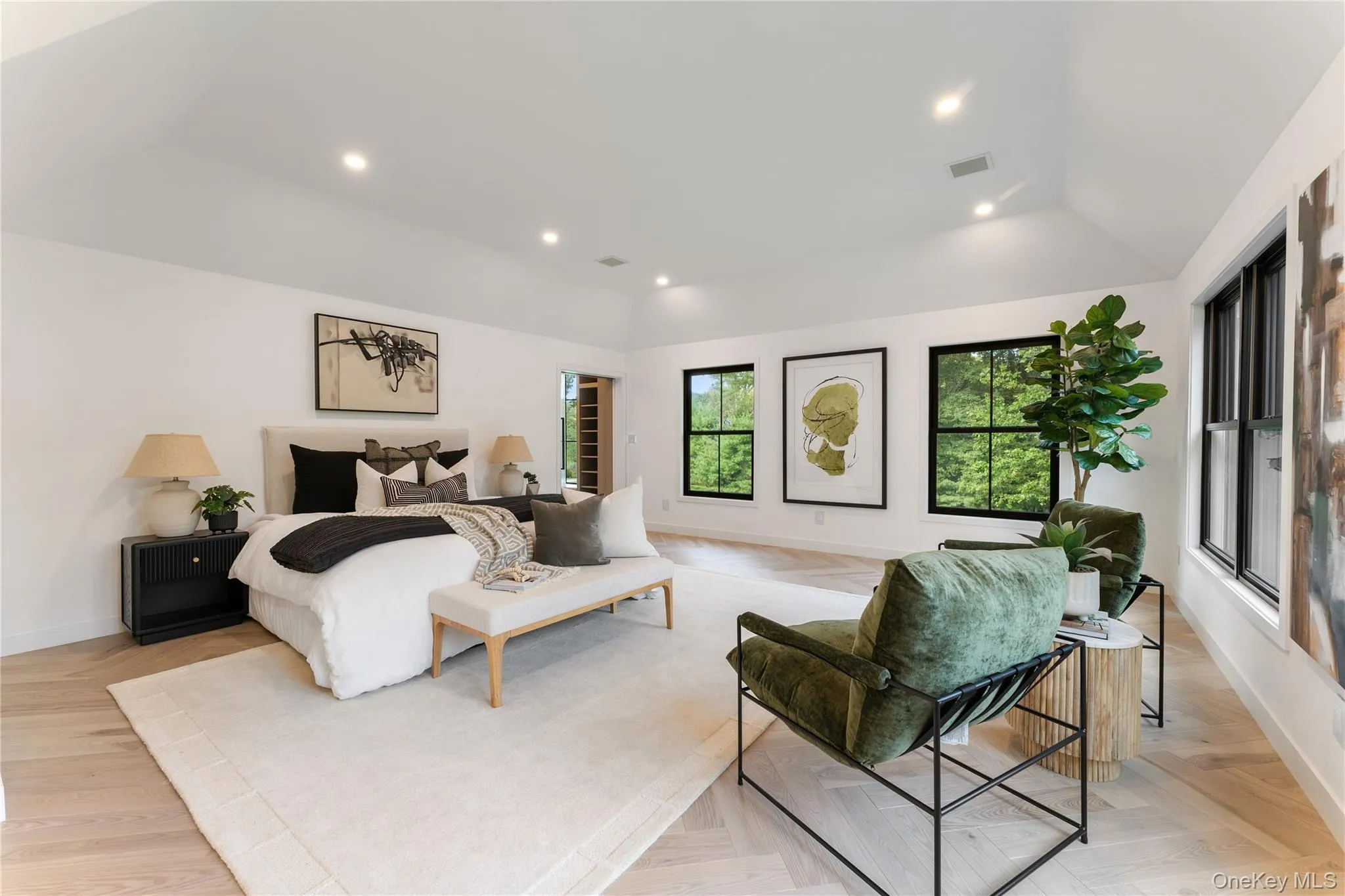 Bedroom featuring recessed lighting, vaulted ceiling, and parquet flooring Bedroom featuring recessed lighting, vaulted ceiling, and parquet flooring