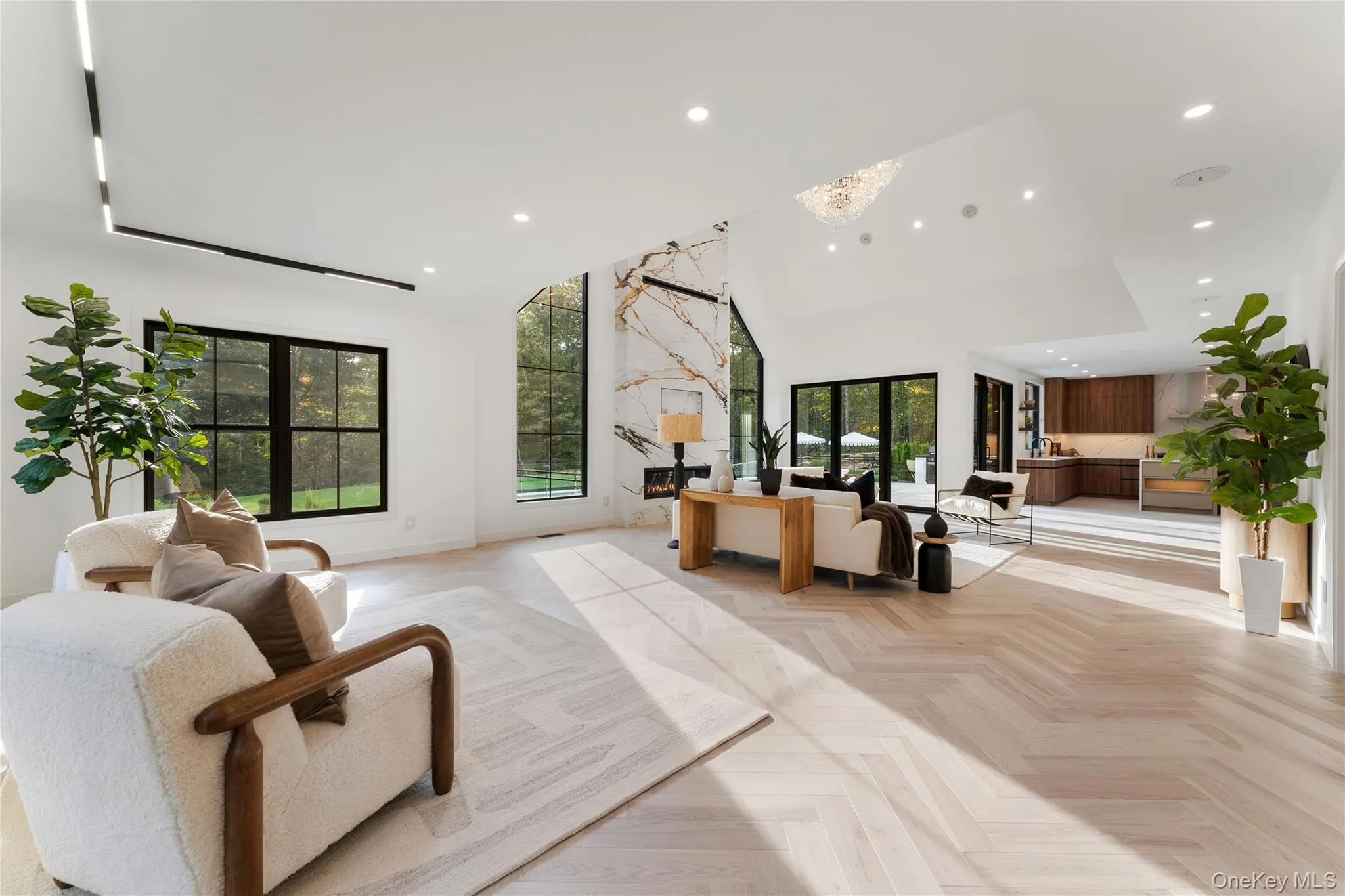 Living Room featuring recessed lighting and a high ceiling Living Room featuring recessed lighting and a high ceiling