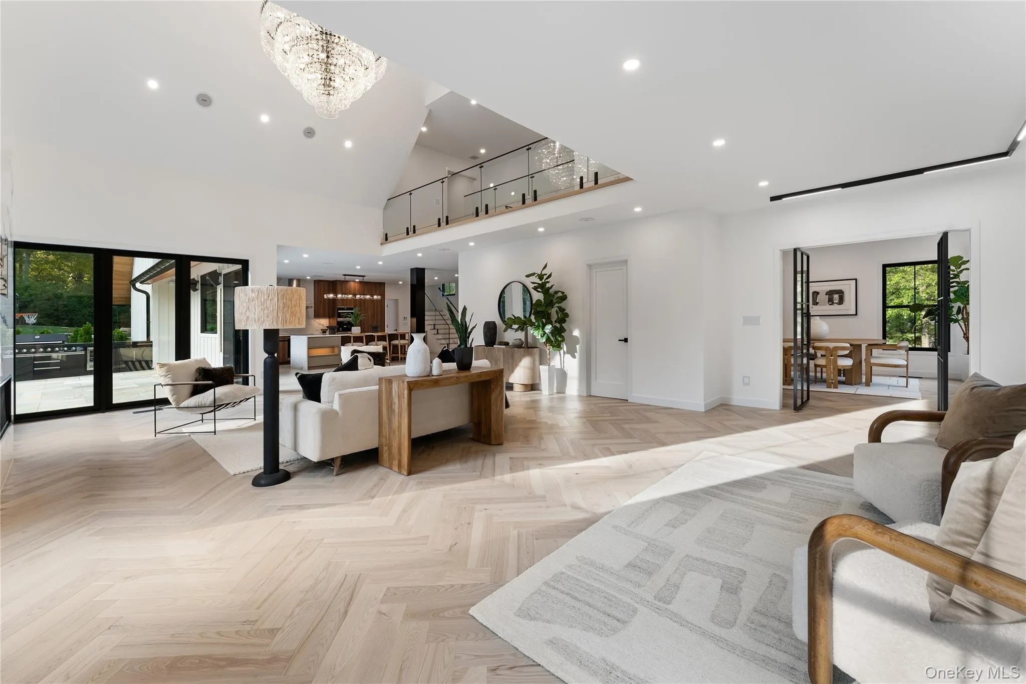 Living Room featuring recessed lighting and a high ceiling Living Room featuring recessed lighting and a high ceiling