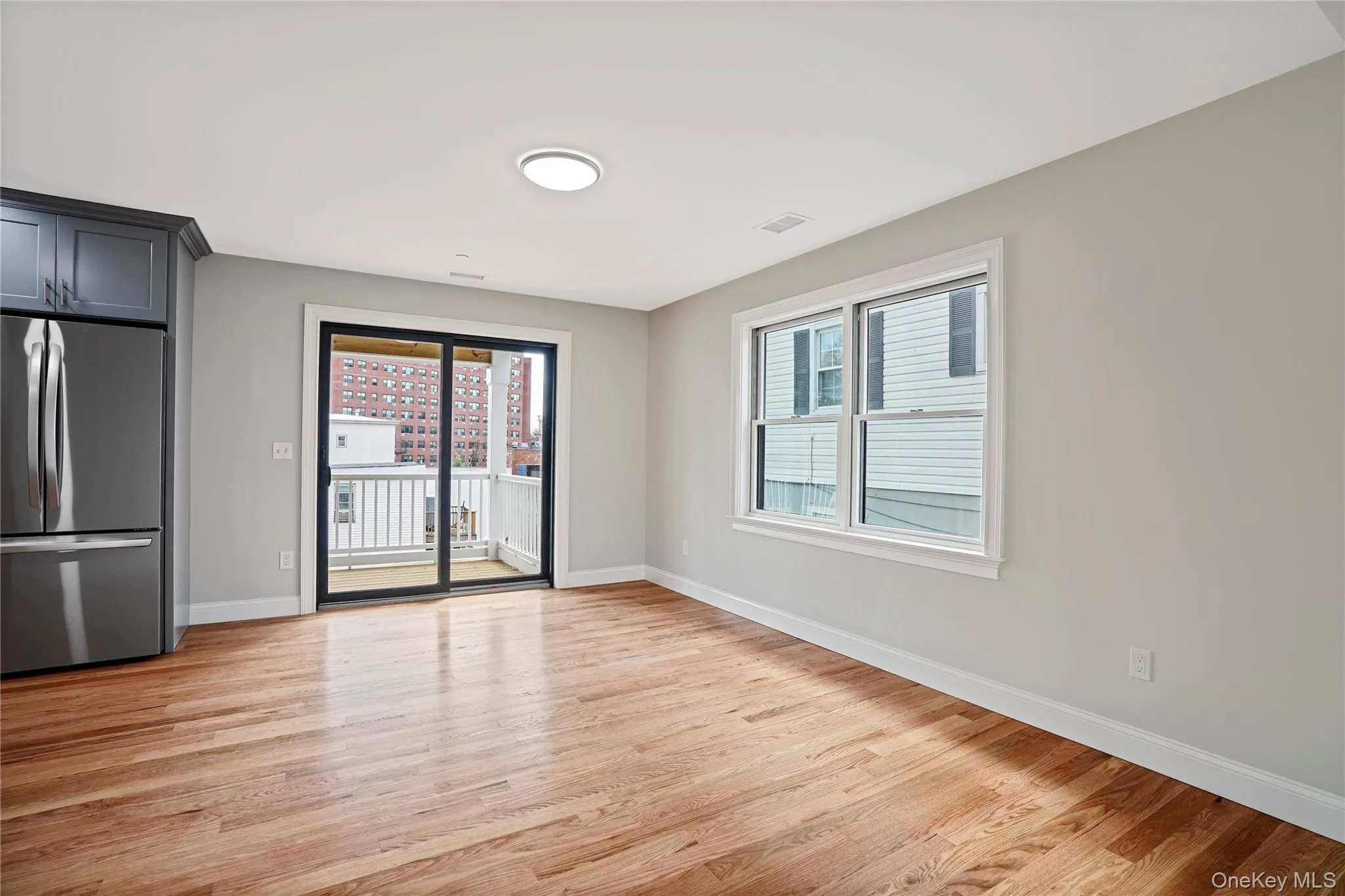 Sliding glass doors to deck, off of kitchen. Sliding glass doors to deck, off of kitchen.