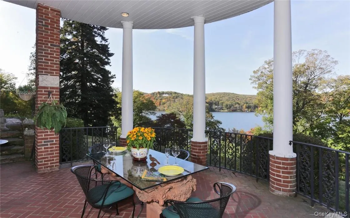 Expansive covered lakeside terrace perfect for al fresco dining Expansive covered lakeside terrace perfect for al fresco dining
