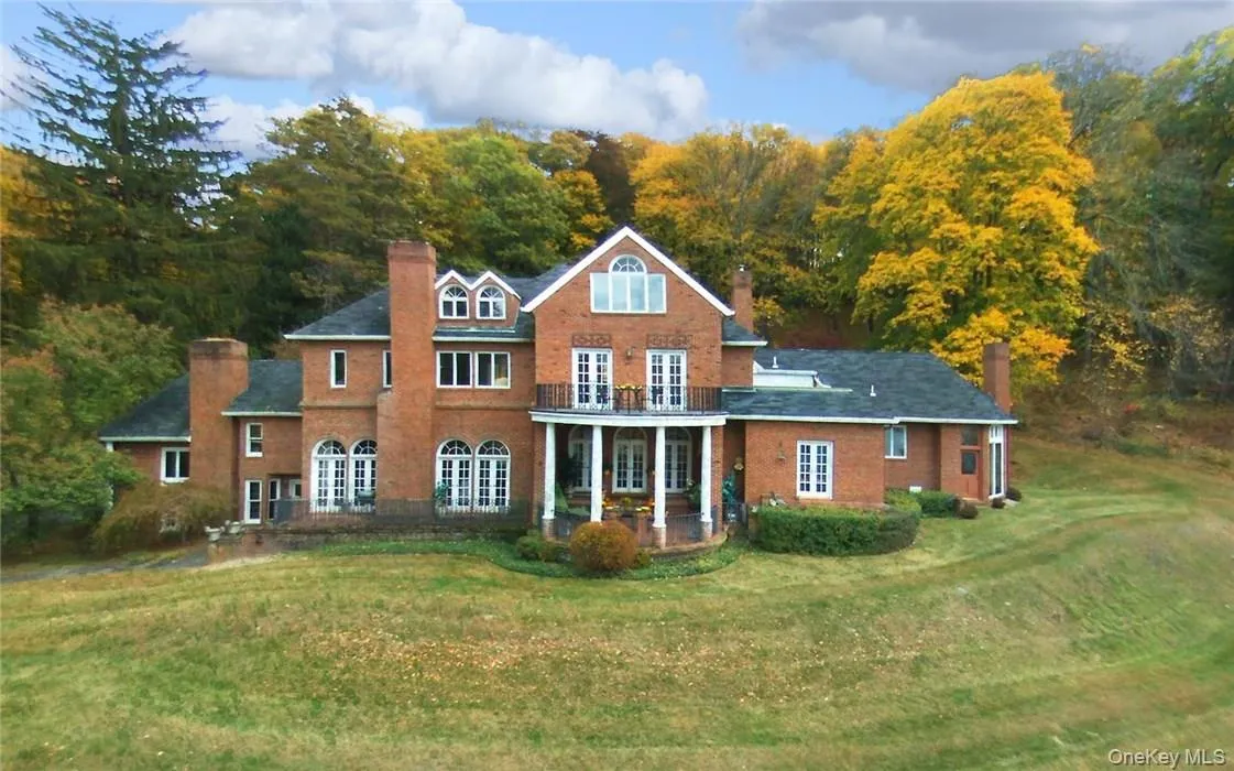 West elevation of house with autumn foliage West elevation of house with autumn foliage