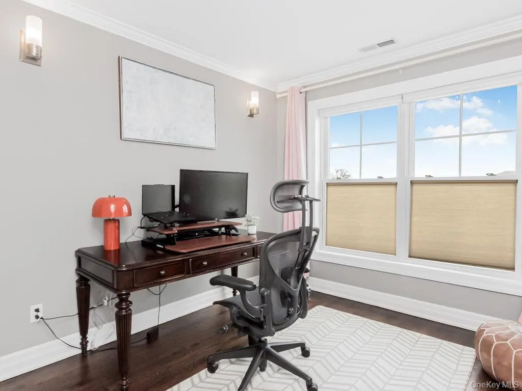 Northeastern bedroom being used as a office Northeastern bedroom being used as a office