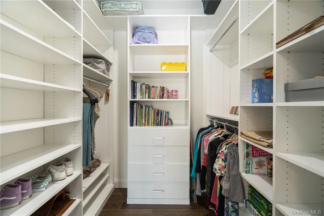 Fabulous walk in closet with custom built ins. Fabulous walk in closet with custom built ins.