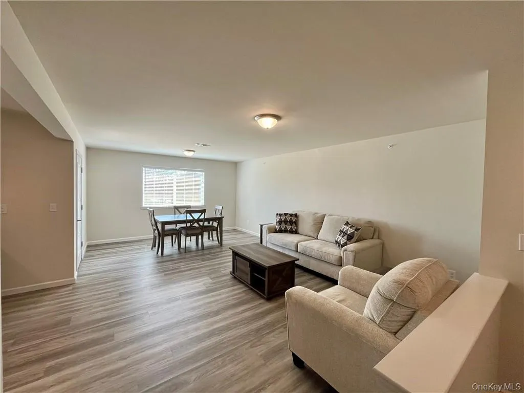 Living room with hardwood / wood-style flooring Living room with hardwood / wood-style flooring