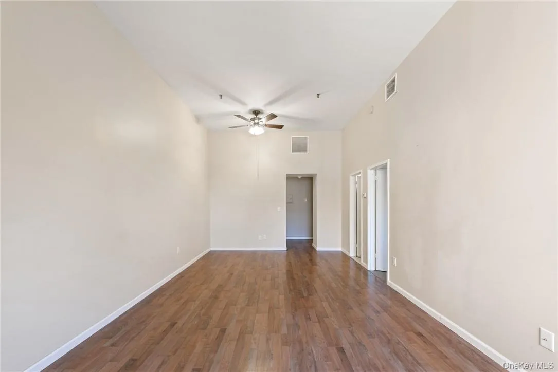 Living/dining room view facing toward foyer and kitchen Living/dining room view facing toward foyer and kitchen
