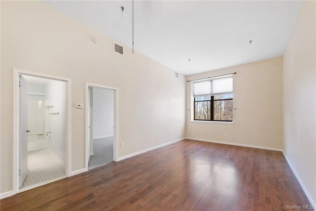 Spacious, light, and bright living/dining room with courtyard views Spacious, light, and bright living/dining room with courtyard views