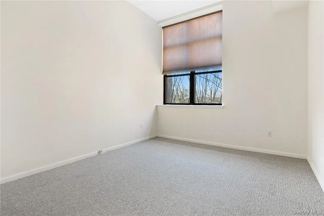 Bedroom with large organized closet, also overlooking courtyard Bedroom with large organized closet, also overlooking courtyard