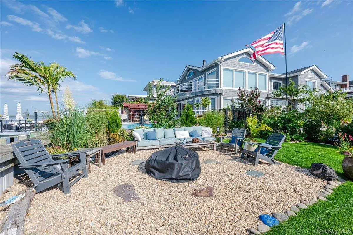 View of yard with a patio area and an outdoor living space with a fire pit View of yard with a patio area and an outdoor living space with a fire pit