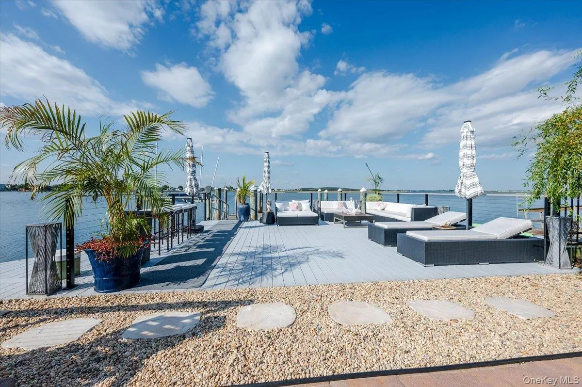 View of property's community featuring a water view and an outdoor living space View of property's community featuring a water view and an outdoor living space