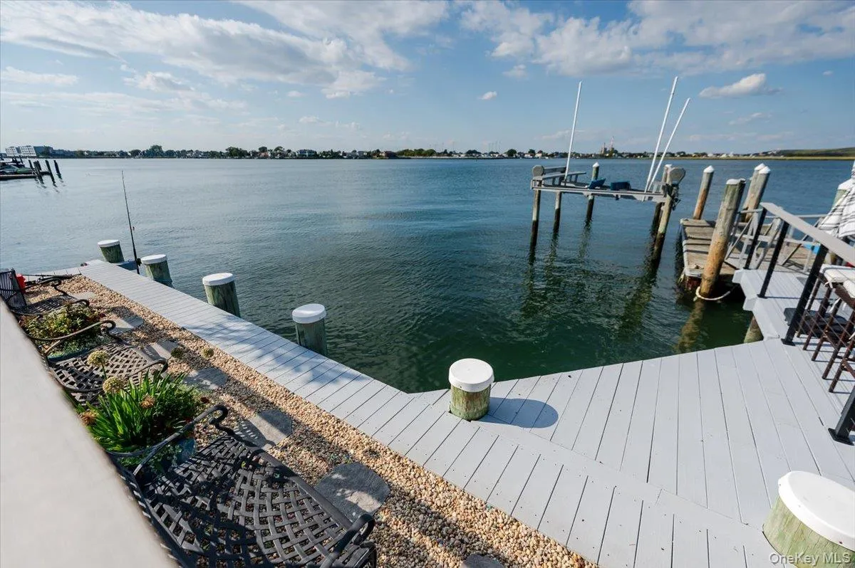 Dock area with a water view and boat lift Dock area with a water view and boat lift