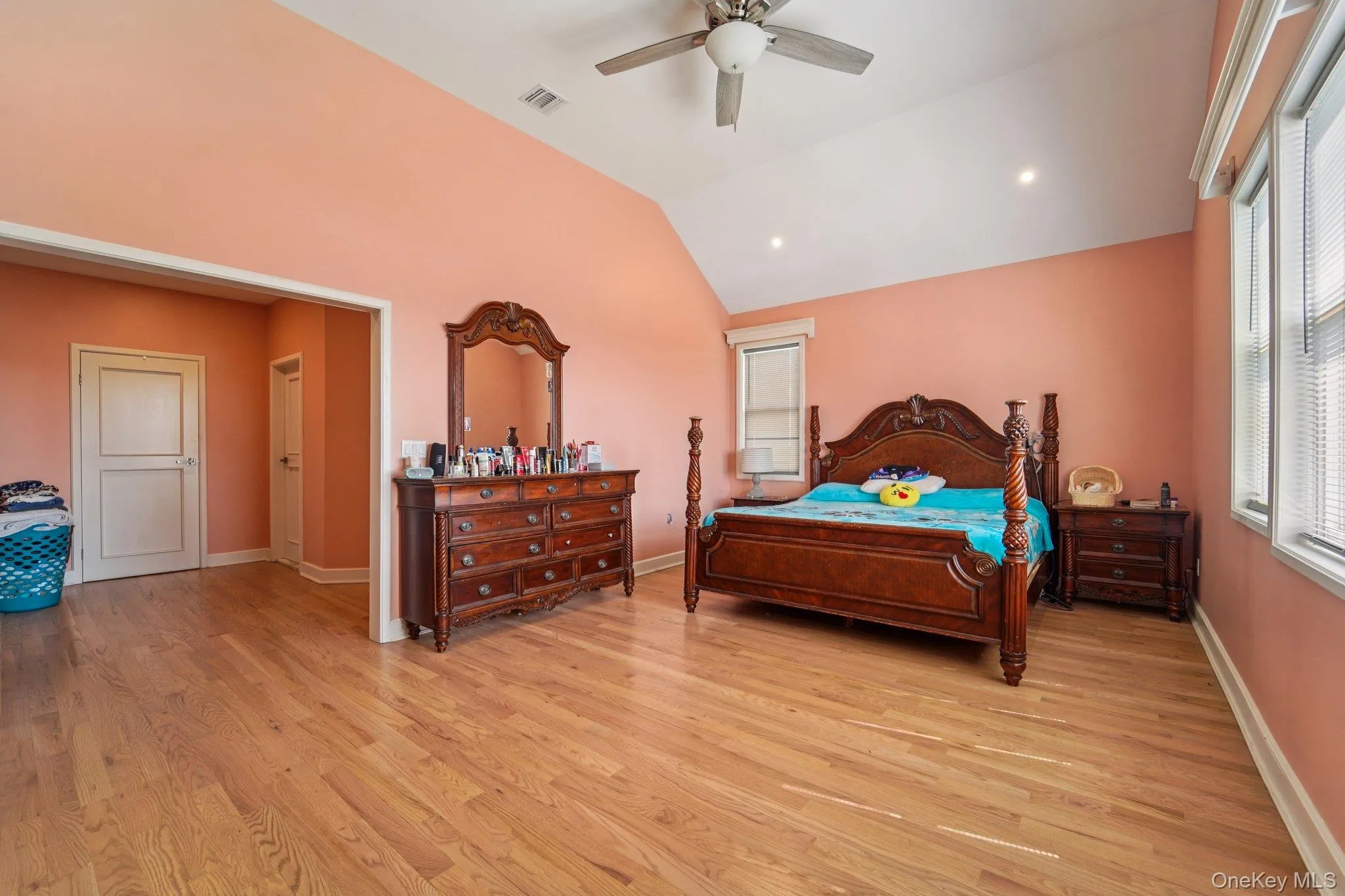 This room features a high cathedral ceiling, hardwood floors, fireplace and a vaulted ceiling with a ceiling fan. This room features a high cathedral ceiling, hardwood floors, fireplace and a vaulted ceiling with a ceiling fan.