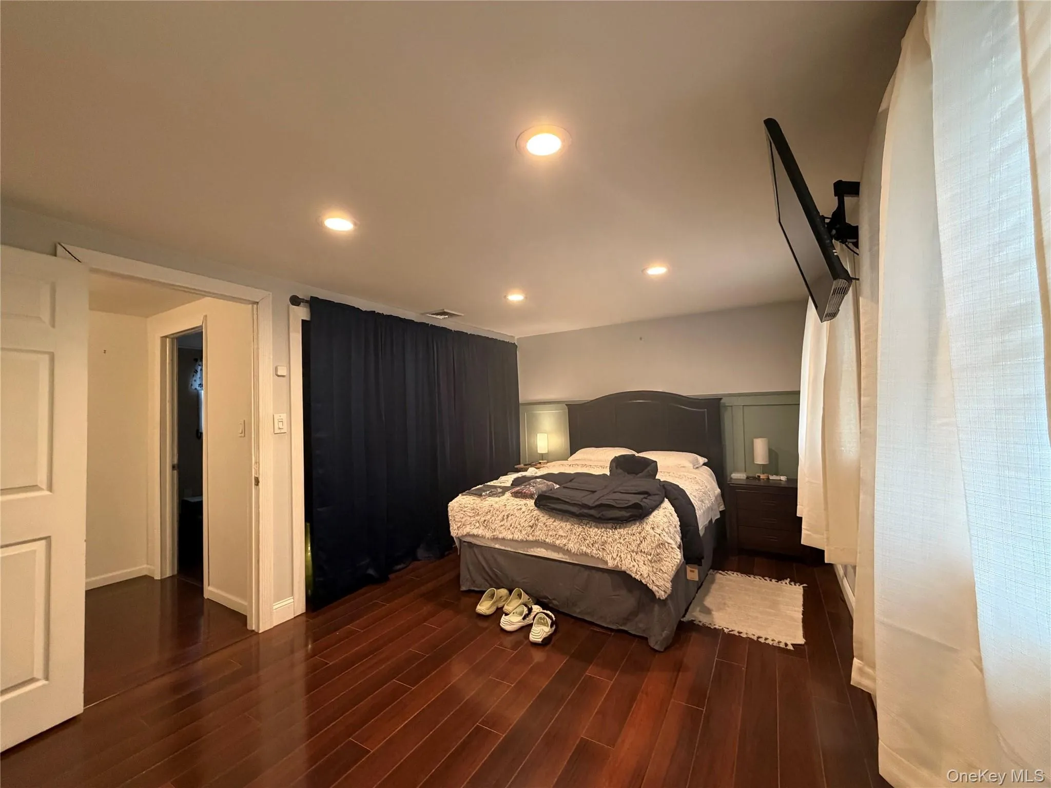 This room features rich hardwood flooring and recessed lighting This room features rich hardwood flooring and recessed lighting
