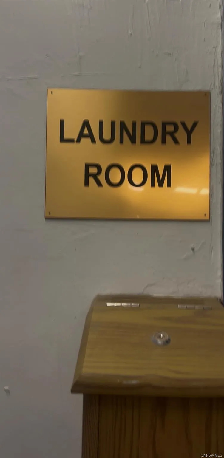 Dedicated laundry room, clearly marked with a golden sign Dedicated laundry room, clearly marked with a golden sign
