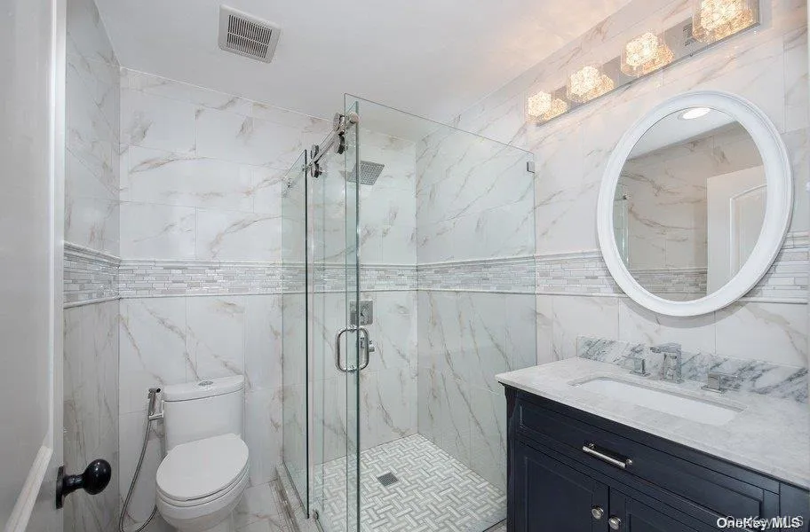Full bath, first floor off SItting room - single sink vanity with stall shower, glass entry Full bath, first floor off SItting room - single sink vanity with stall shower, glass entry