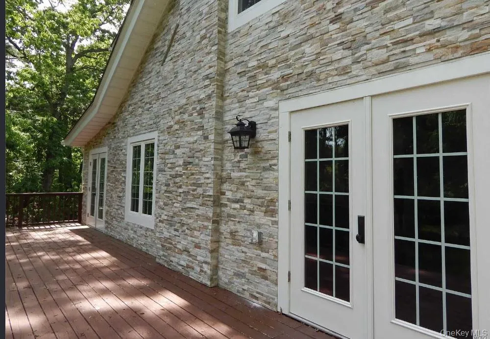 Ground level Deck off Formal Dining Room Ground level Deck off Formal Dining Room