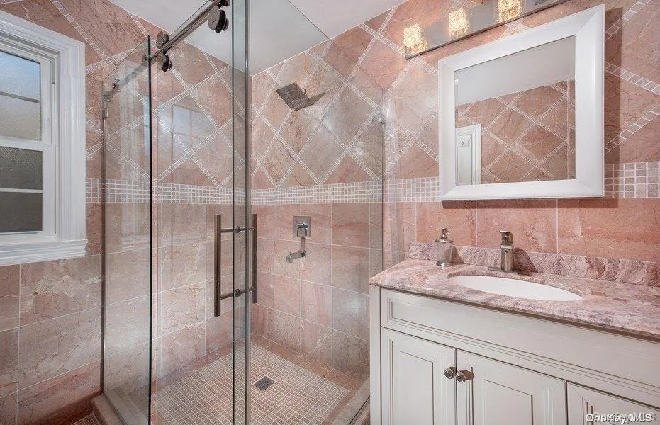 En Suite with single sink vanity, stal shower with glass door entry En Suite with single sink vanity, stal shower with glass door entry