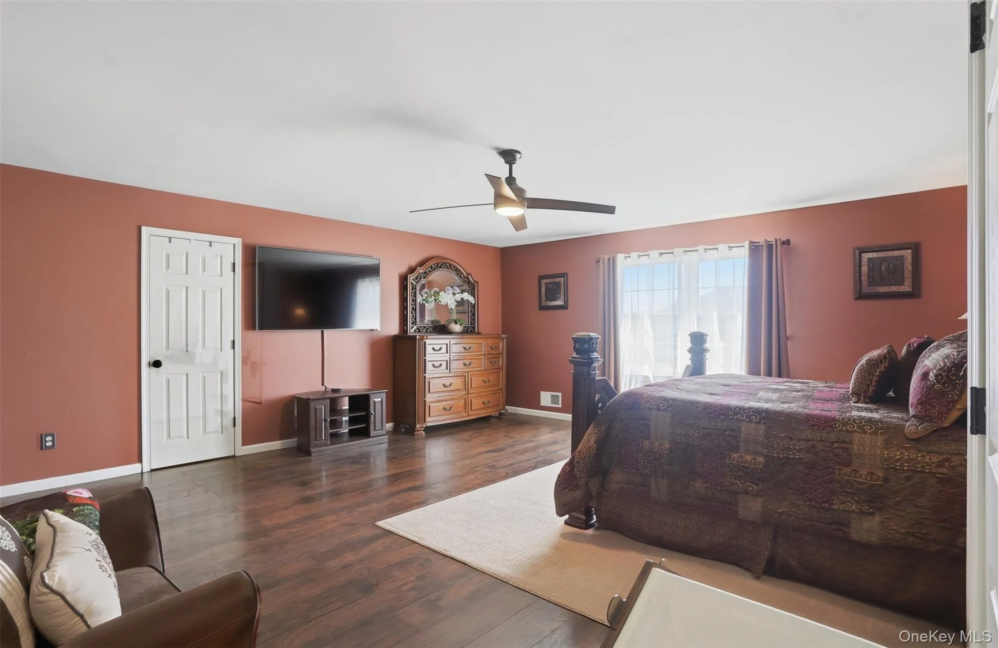 Oversized primary bedroom with spacious walk-in closet Oversized primary bedroom with spacious walk-in closet