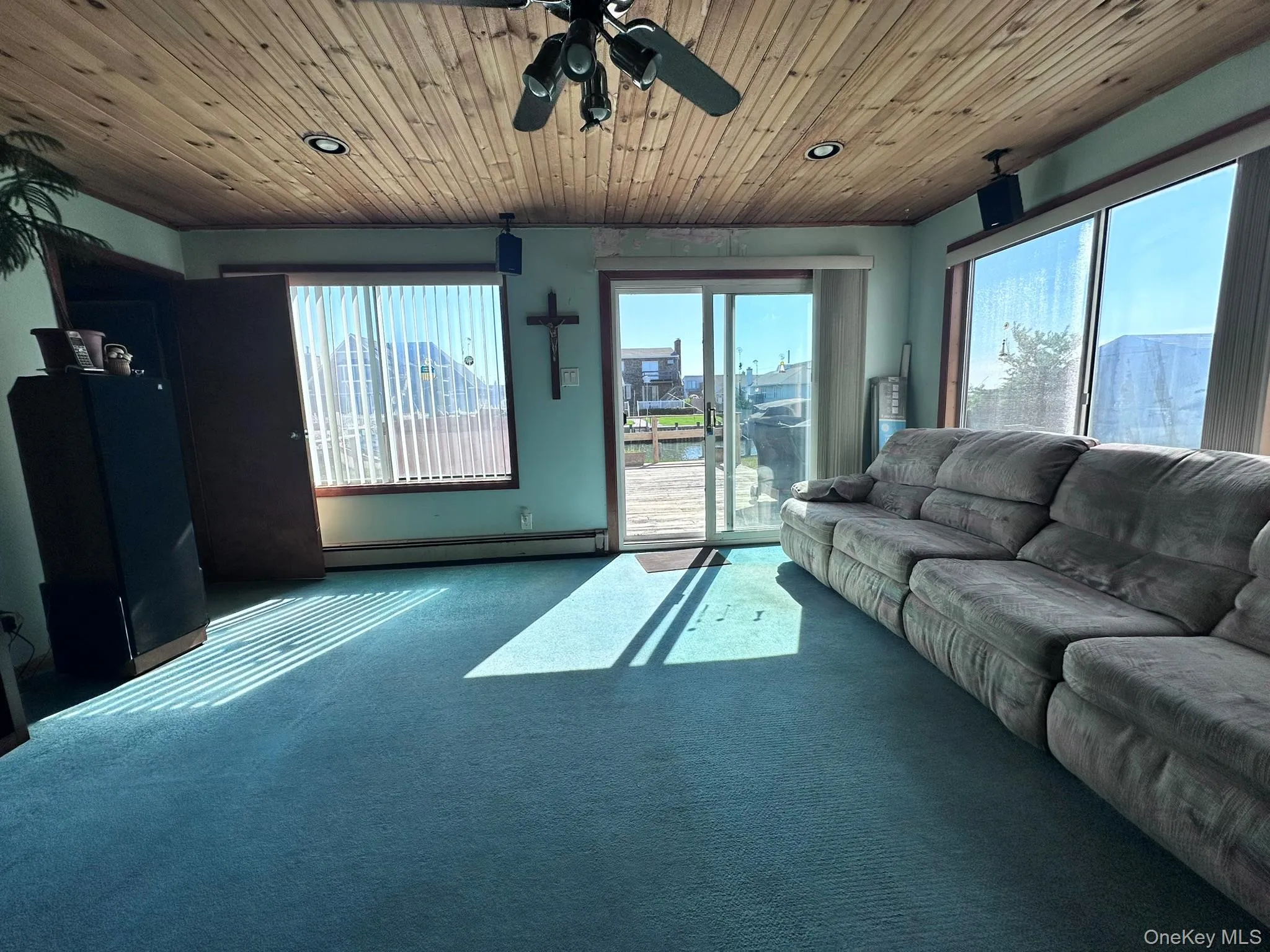 Room featuring a wood-panel ceiling with recessed lighting and a ceiling fan Room featuring a wood-panel ceiling with recessed lighting and a ceiling fan