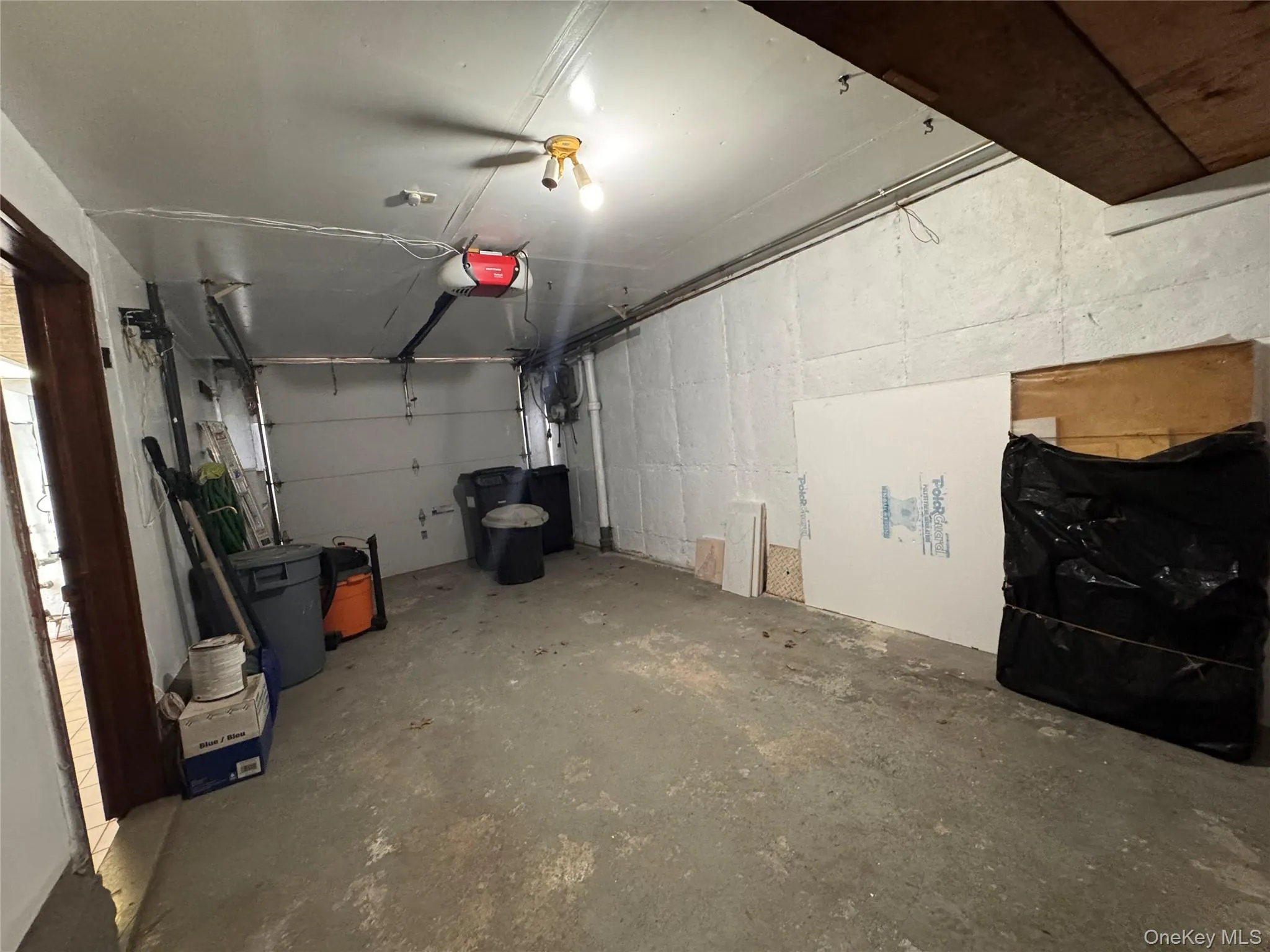 1 Car Garage with shelf, great for storage and side entrance to the basement 1 Car Garage with shelf, great for storage and side entrance to the basement