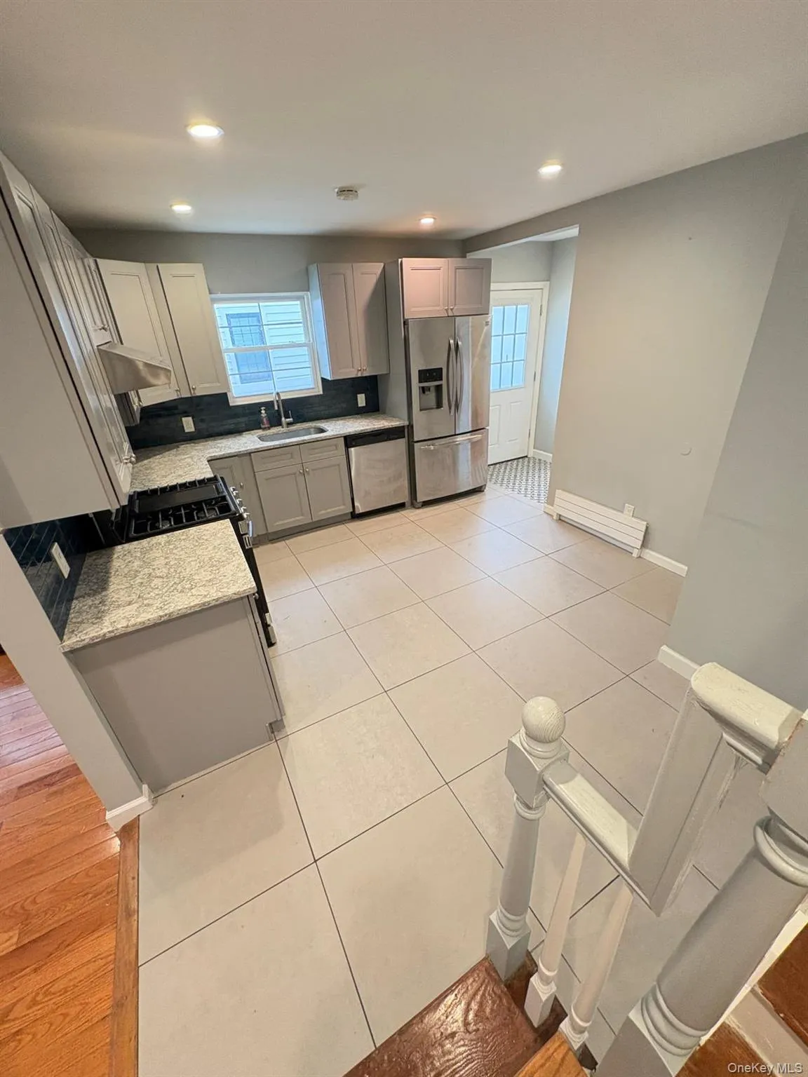 View of kitchen from stairs View of kitchen from stairs