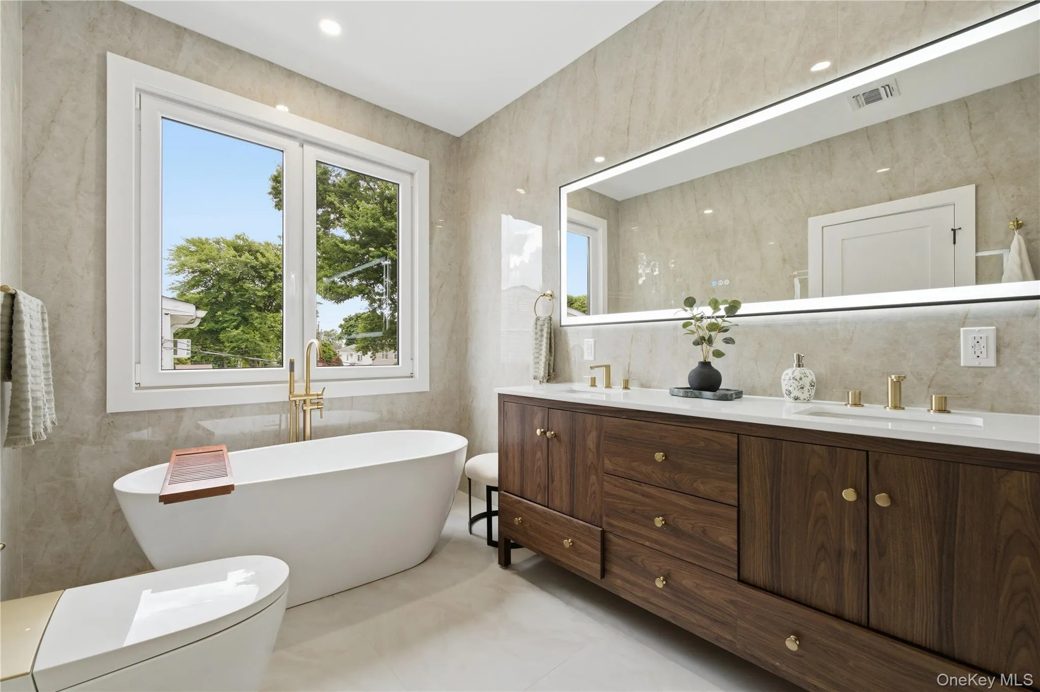 Soaking tub with bidet toilet in primary bath spa style Soaking tub with bidet toilet in primary bath spa style