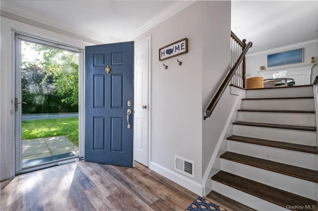 Gracious entry foyer with custom built-in front hall closet. French doors leading to family room (or additional BR), full bath. Additional door leading to one car garage with additional storage. Gracious entry foyer with custom built-in front hall closet. French doors leading to family room (or additional BR), full bath. Additional door leading to one car garage with additional storage.