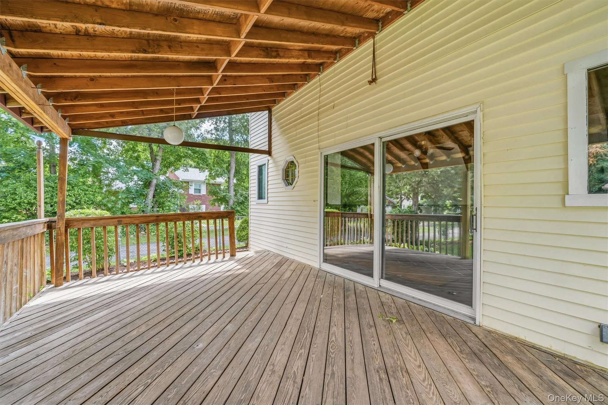 Step outside to the large, covered deck. Step outside to the large, covered deck.