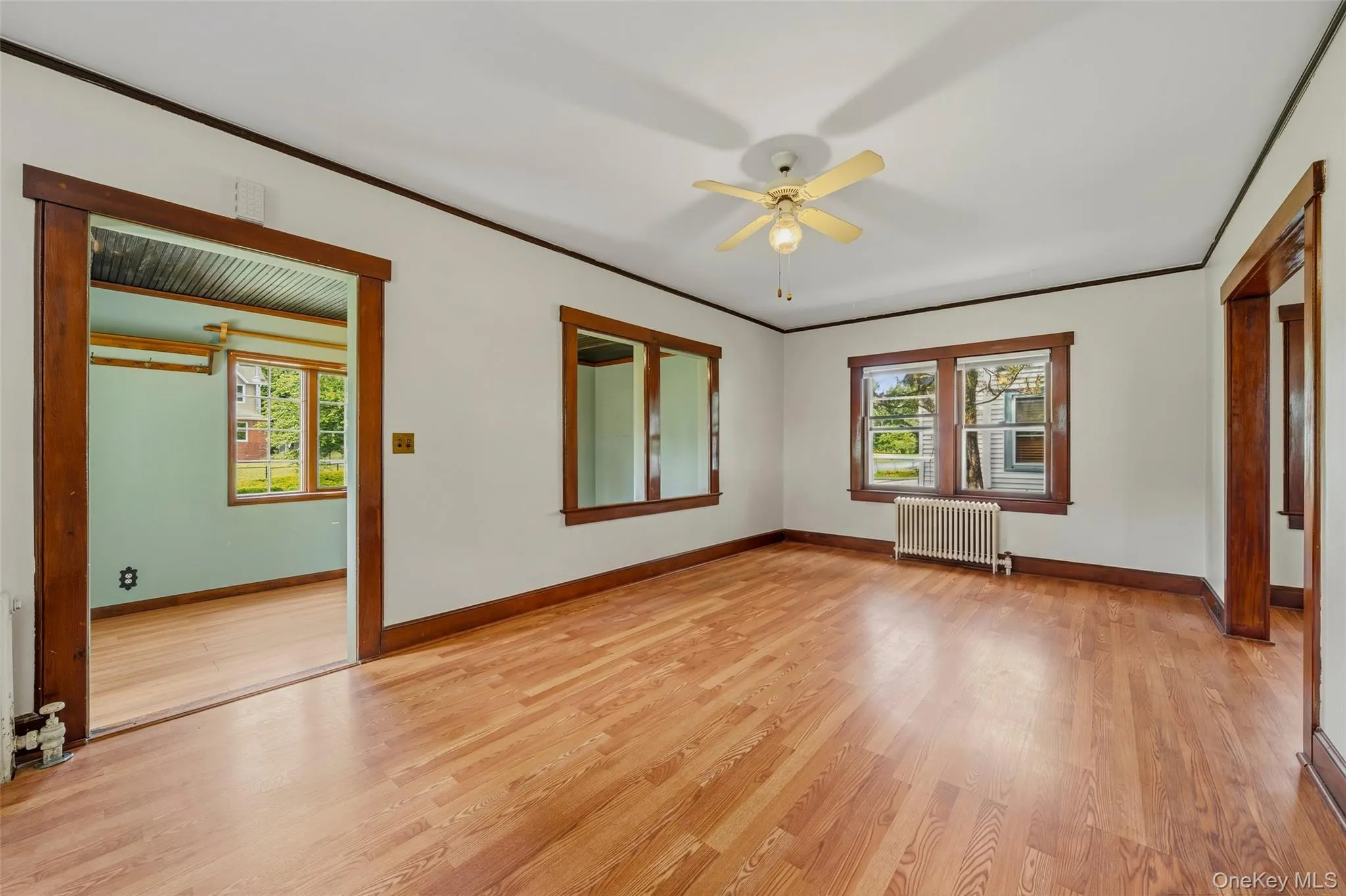 Step into the large living room from the enclosed porch Step into the large living room from the enclosed porch