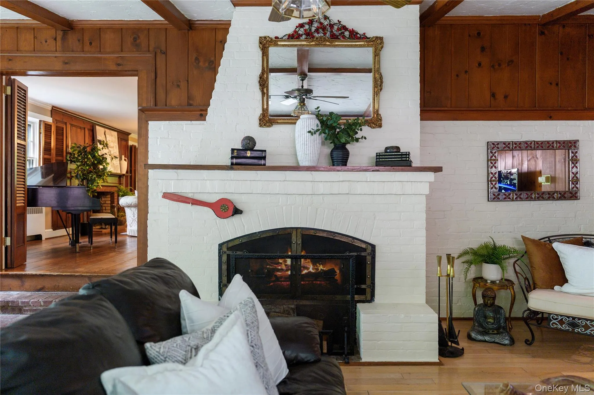 Family room fireplace with hammered wrought iron screen closure Family room fireplace with hammered wrought iron screen closure