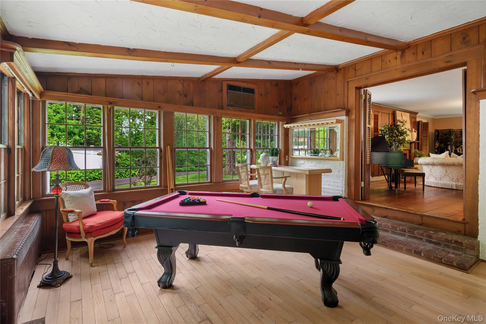 Family room game room area, thirteen 6 over 6 windows wrap around this room to create ample natural light and garden views Family room game room area, thirteen 6 over 6 windows wrap around this room to create ample natural light and garden views
