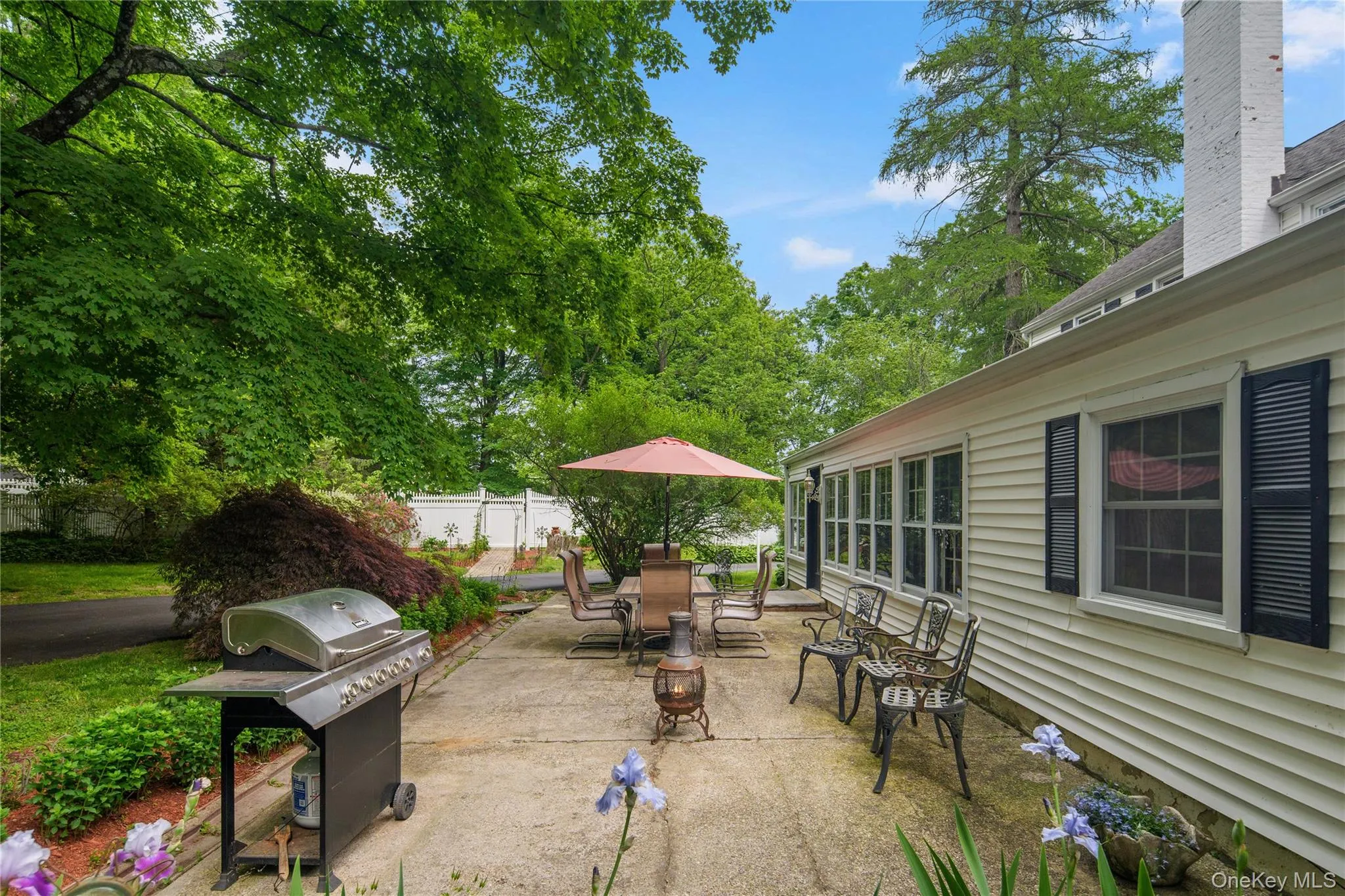 Large patio with door to family room and back entry hall Large patio with door to family room and back entry hall