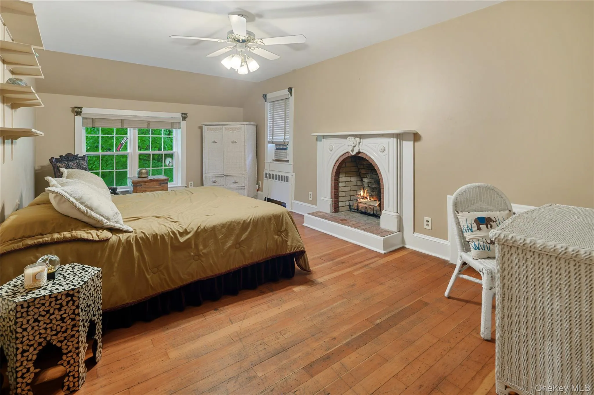 Bedroom 2 with fireplace with carved marble mantle, pine floors, ceiling fan Bedroom 2 with fireplace with carved marble mantle, pine floors, ceiling fan