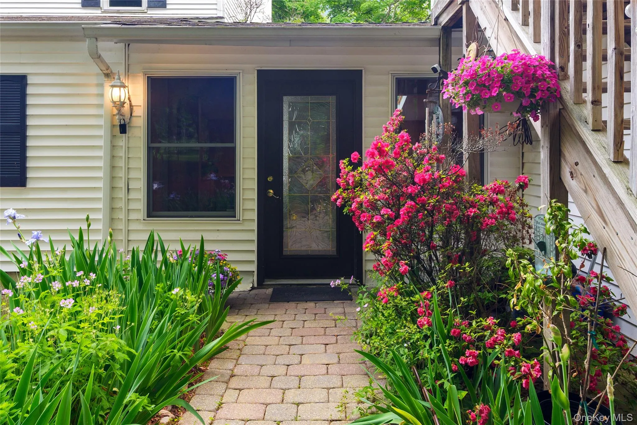 Rear entry with stairs on right to studio apartment Rear entry with stairs on right to studio apartment