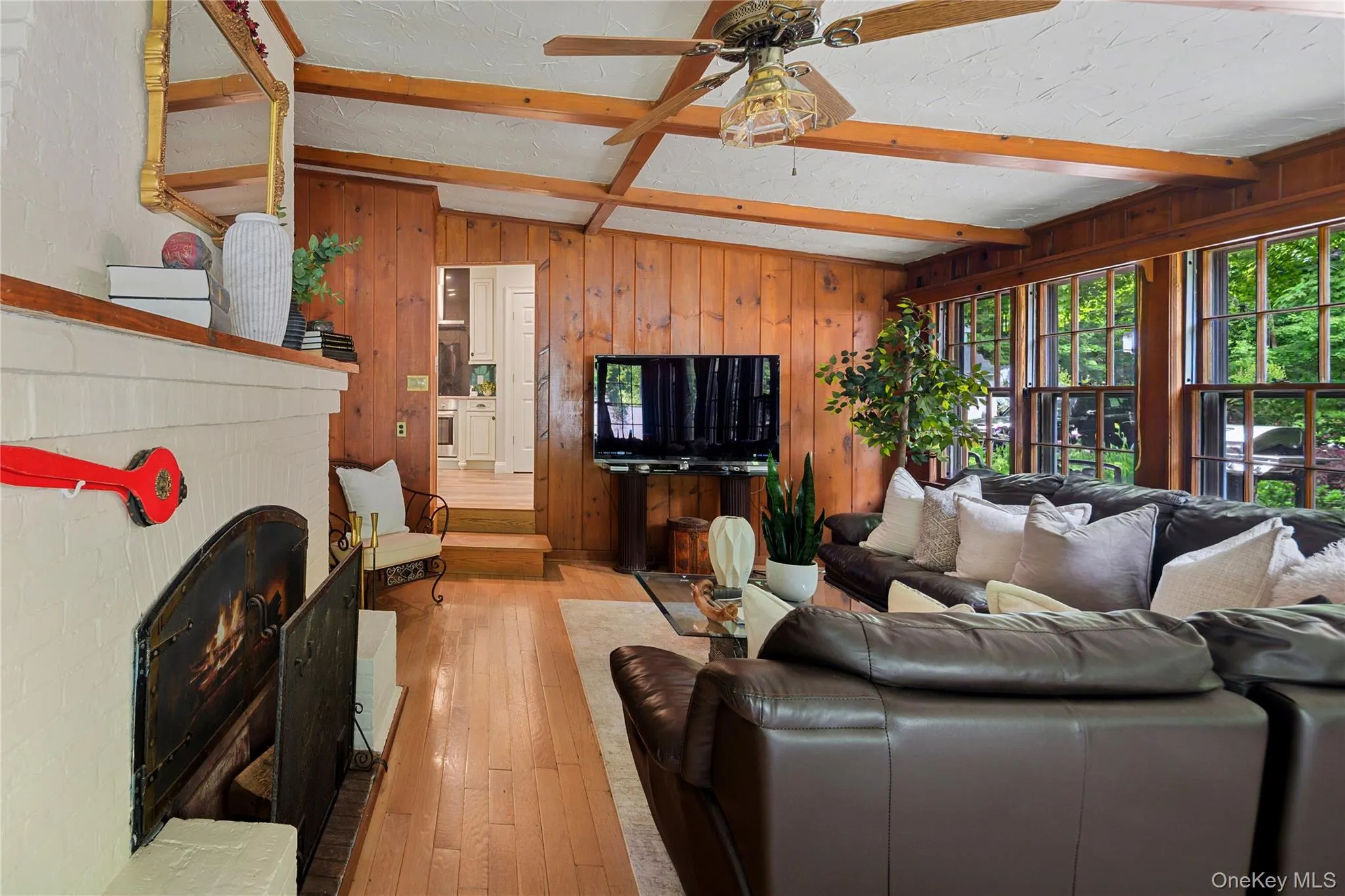 Family room with doorway into eat-in kitchen, ceiling fan Family room with doorway into eat-in kitchen, ceiling fan