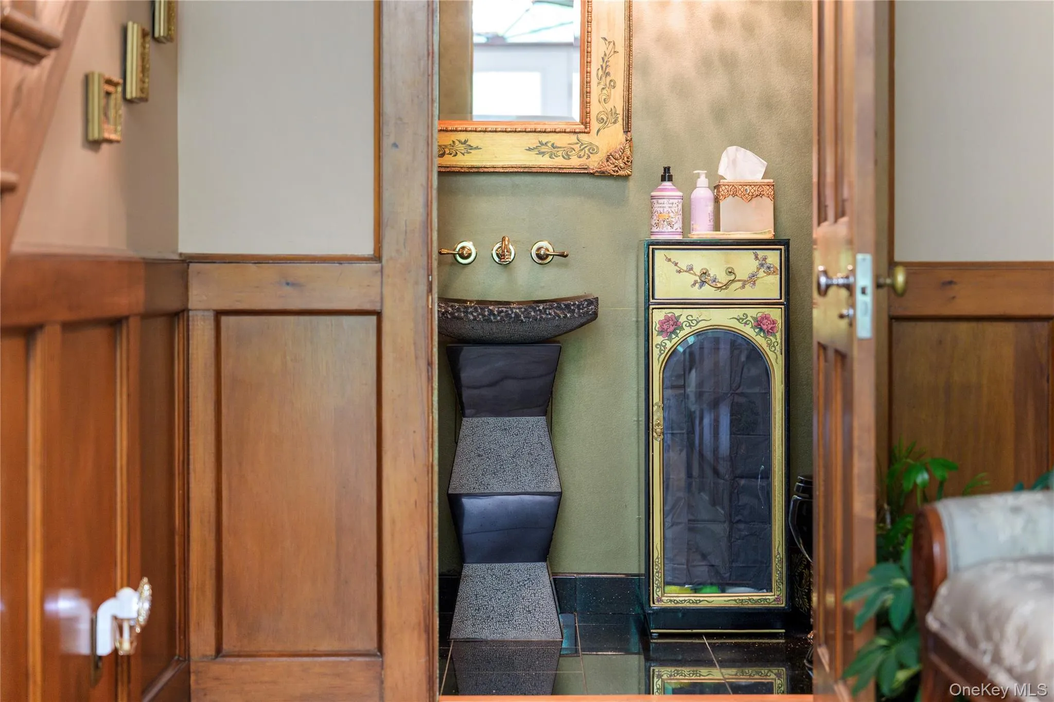 Powder room with sculptural granite pedestal sink with deckled edge, wall mounted faucet, 12 x 12 granite tile floor Powder room with sculptural granite pedestal sink with deckled edge, wall mounted faucet, 12 x 12 granite tile floor