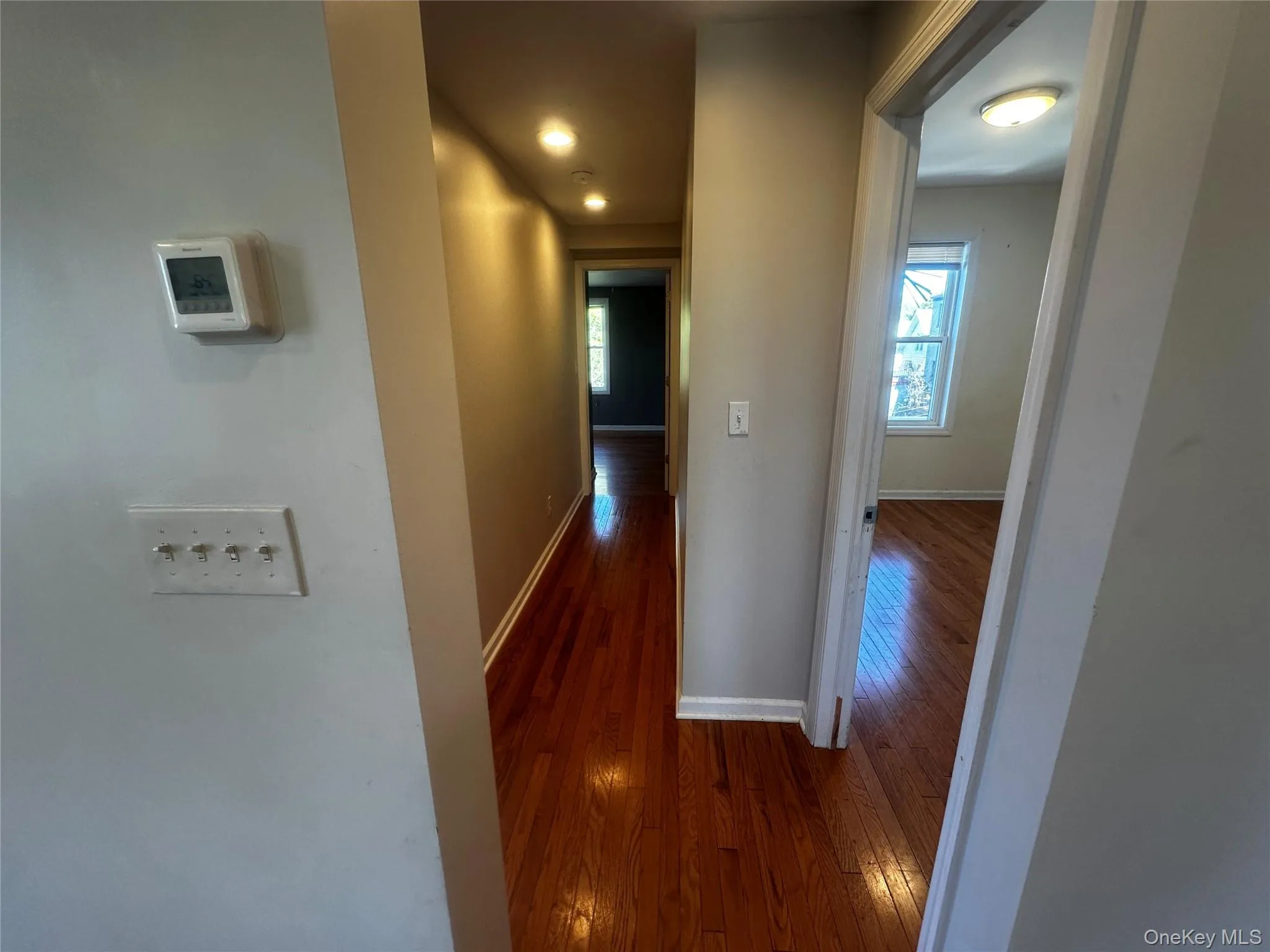 Large hallway connects three bedrooms. Large hallway connects three bedrooms.