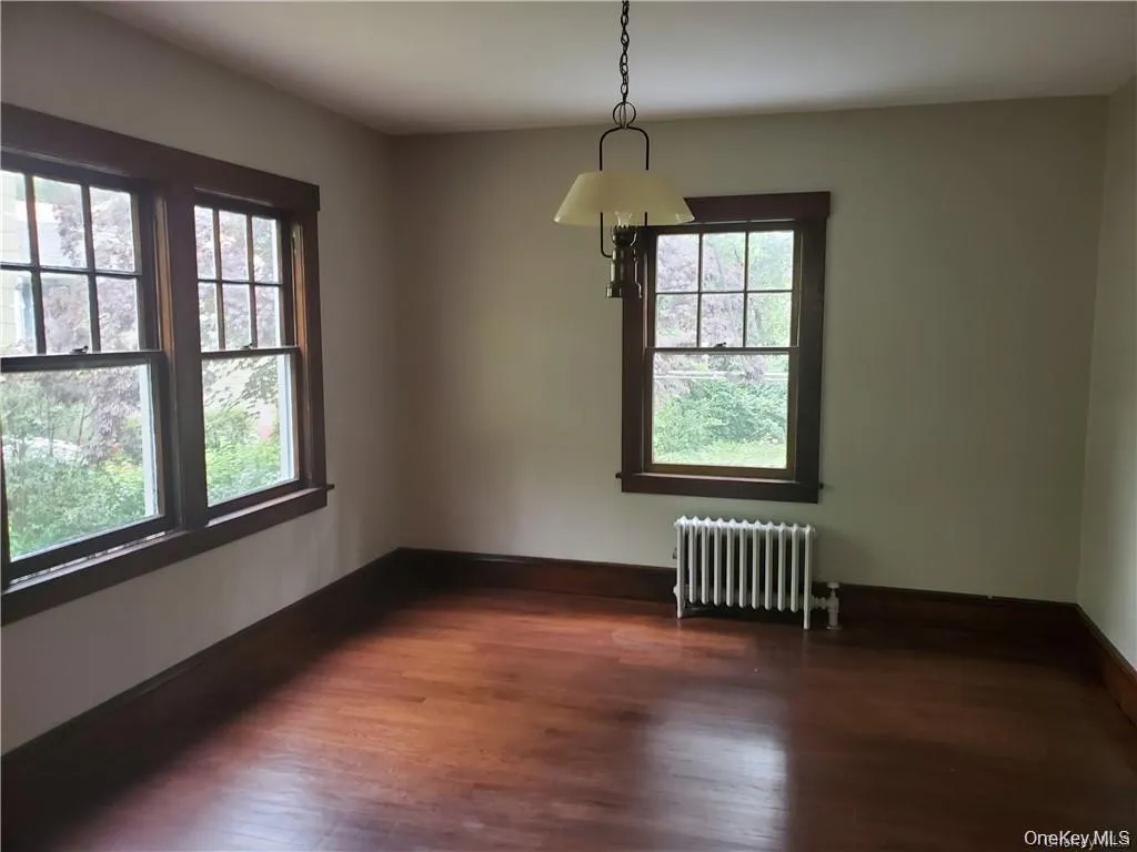 Dinning room with wood flooring Dinning room with wood flooring