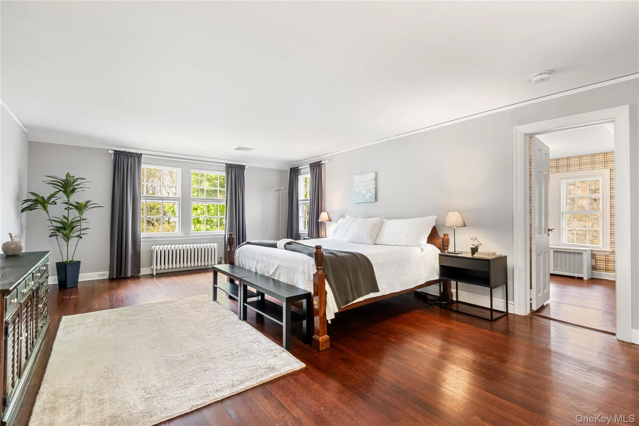 Large primary bedroom with view of walk-in-closet Large primary bedroom with view of walk-in-closet