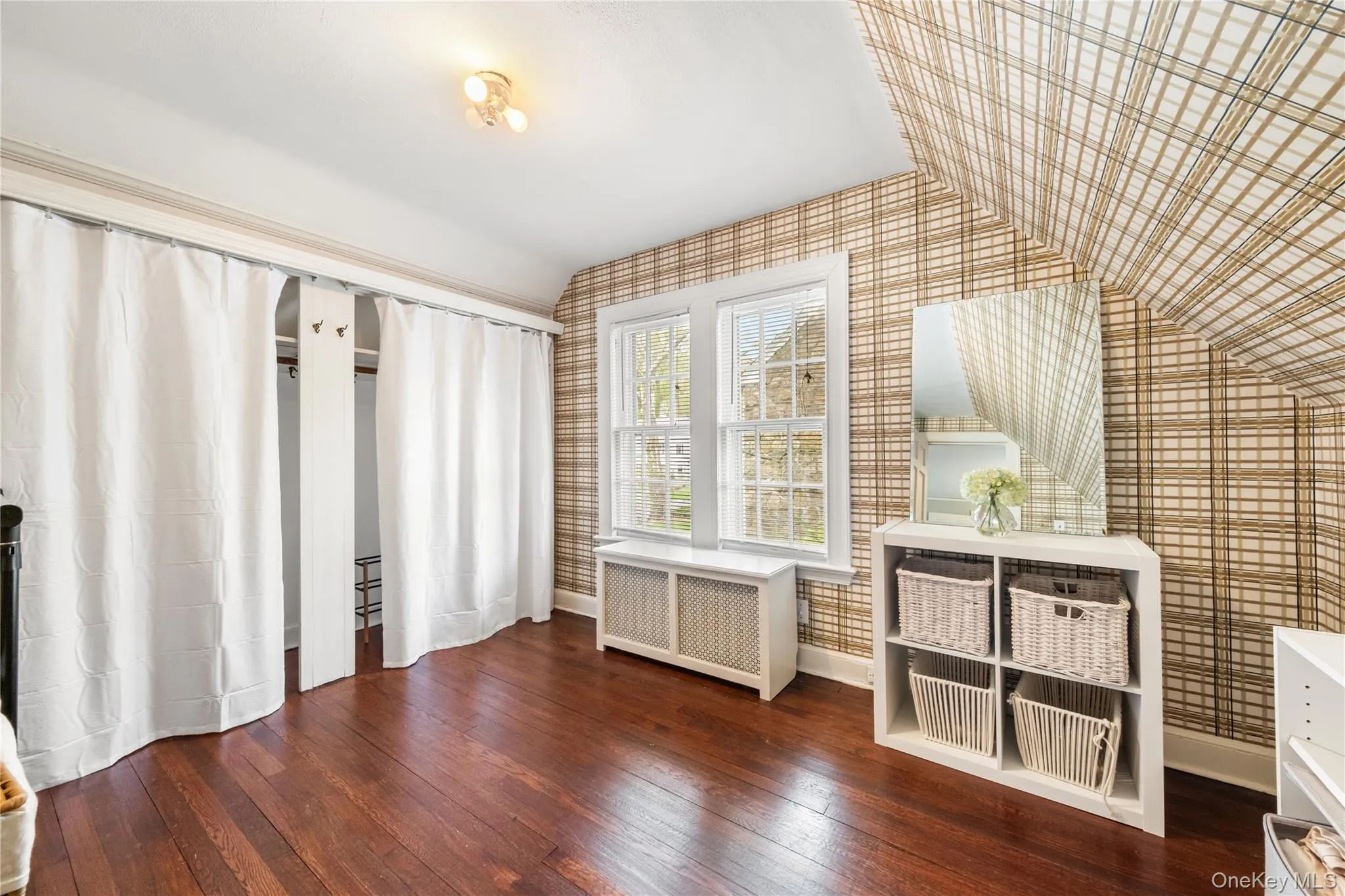 Large walk-in-closet with extra storage space Large walk-in-closet with extra storage space