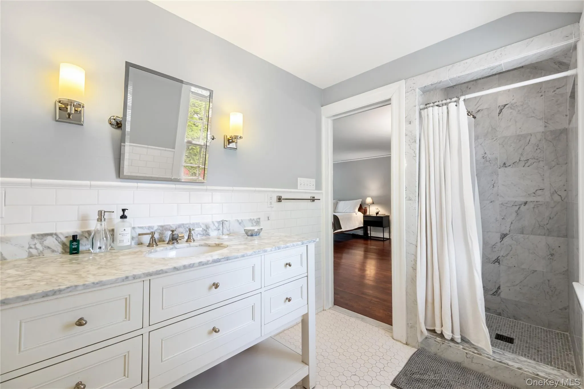 Update primary bath with 2 marble sinks Update primary bath with 2 marble sinks